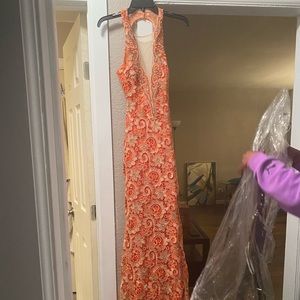 Formal coral dress with gold embellishments